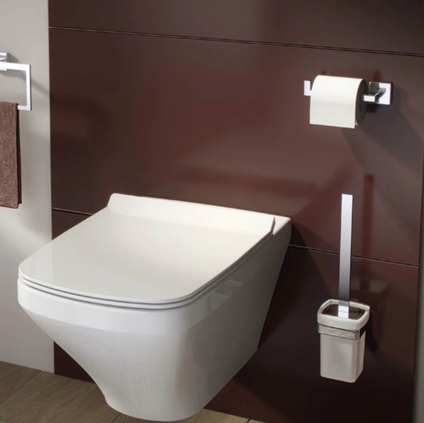 Portarotolo cromato installato su parete in ambiente bagno moderno